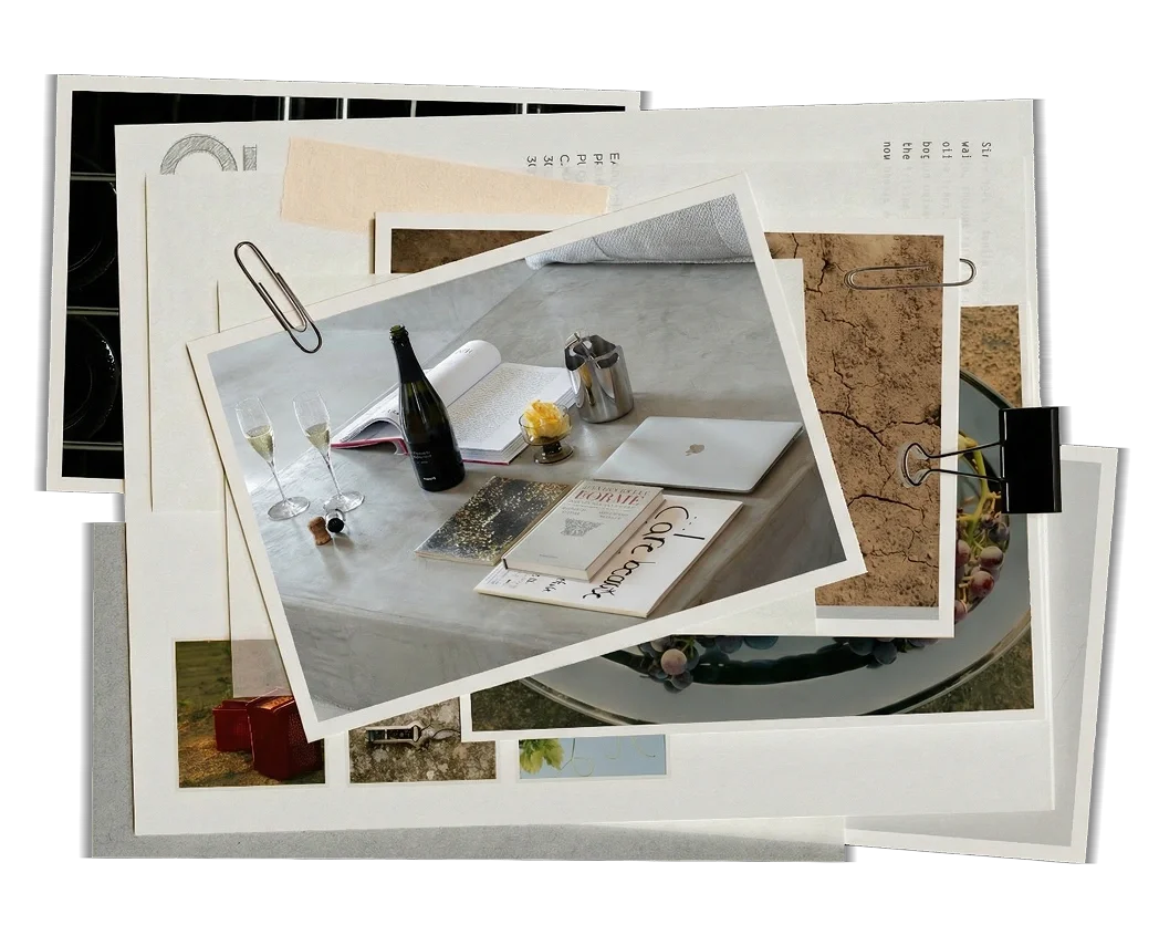 Scrapbook collage with a sparkling wine bottle, glasses and books on a table, clay soil and grape clusters from life at the estate