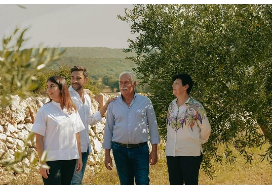 The Frisino family among the centuries-old olive trees of Masseria Vallenza in the Valle d'Itria countryside