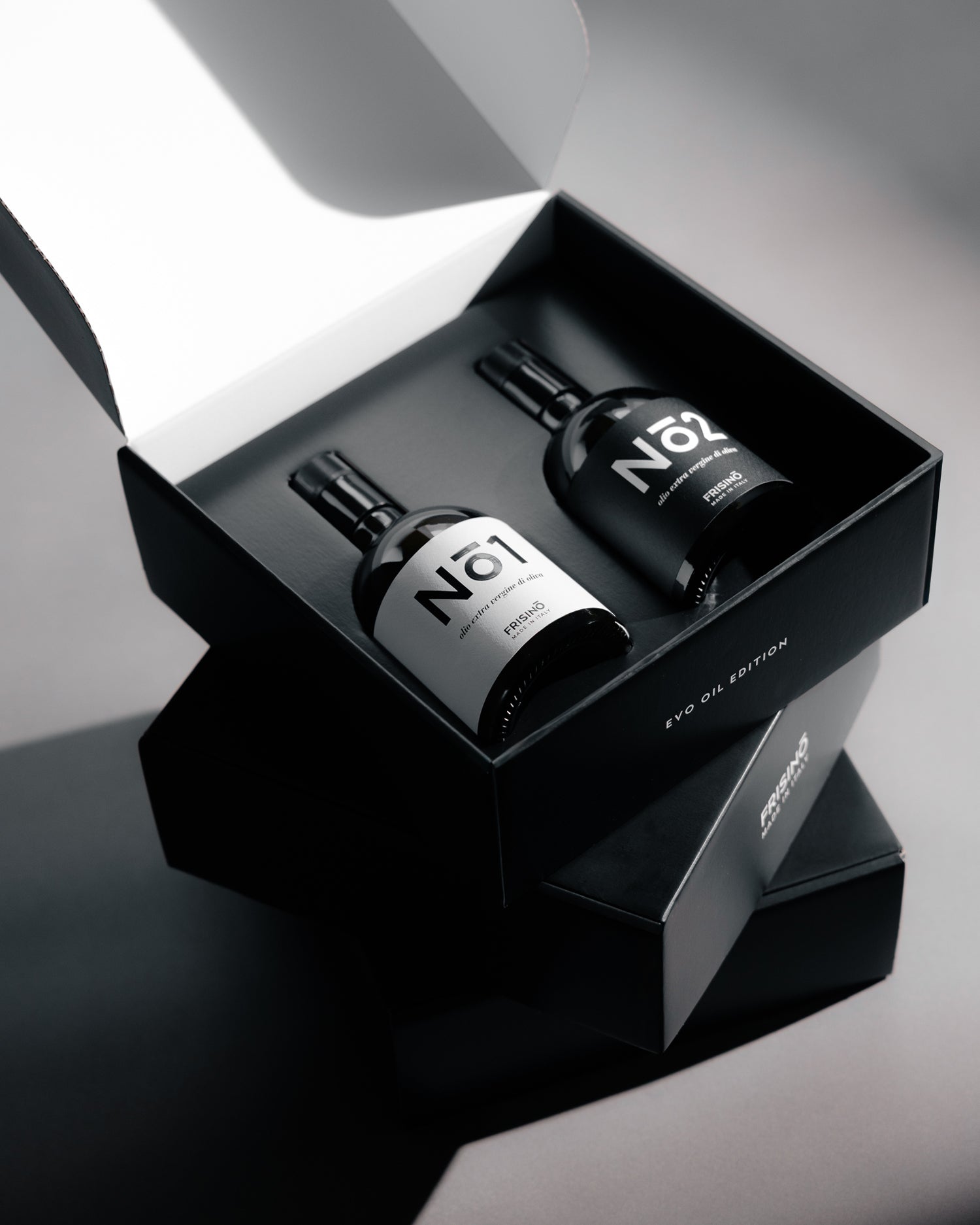 Black Frisino EVO Oil Edition giftbox with two extra virgin olive oil bottles No.1 and No.2, white labels